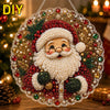 A Christmas Santa face made of pearls and glitter is set within a clear diamond painting suncatcher with a metal chain.