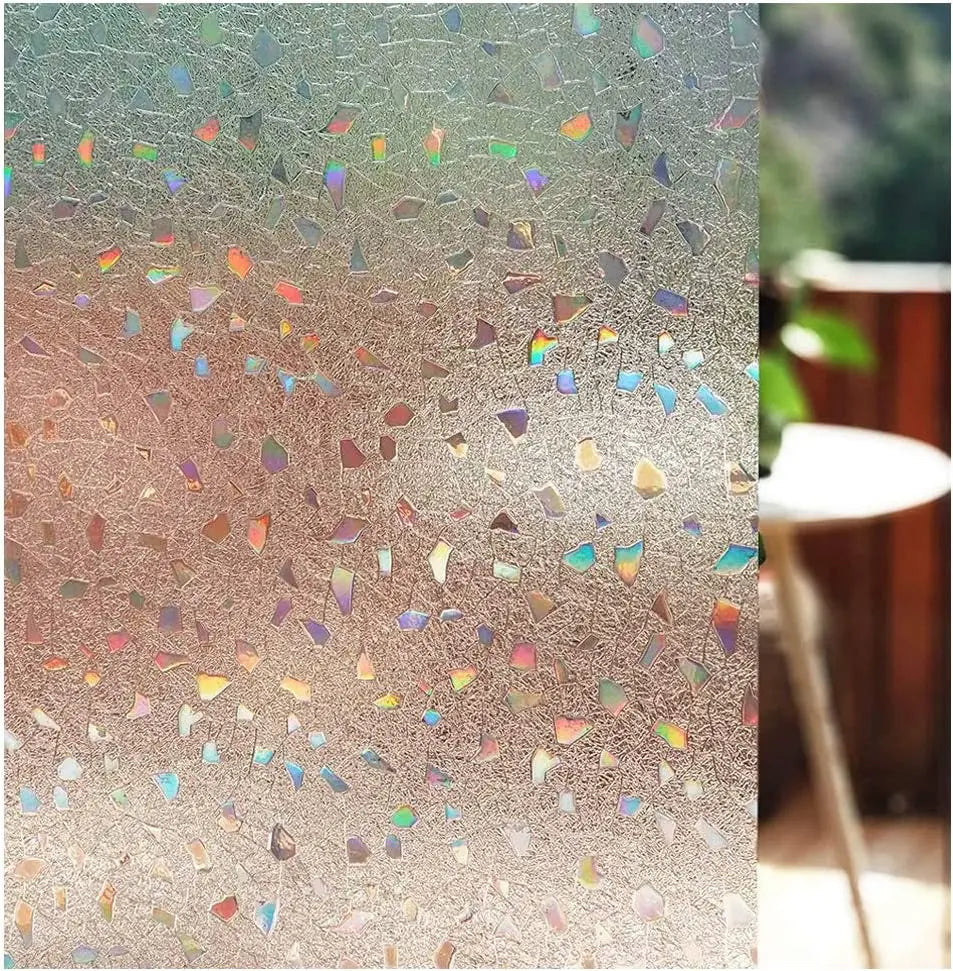 Close-up of frosted window privacy film with iridescent glitter particles scattered across the surface.