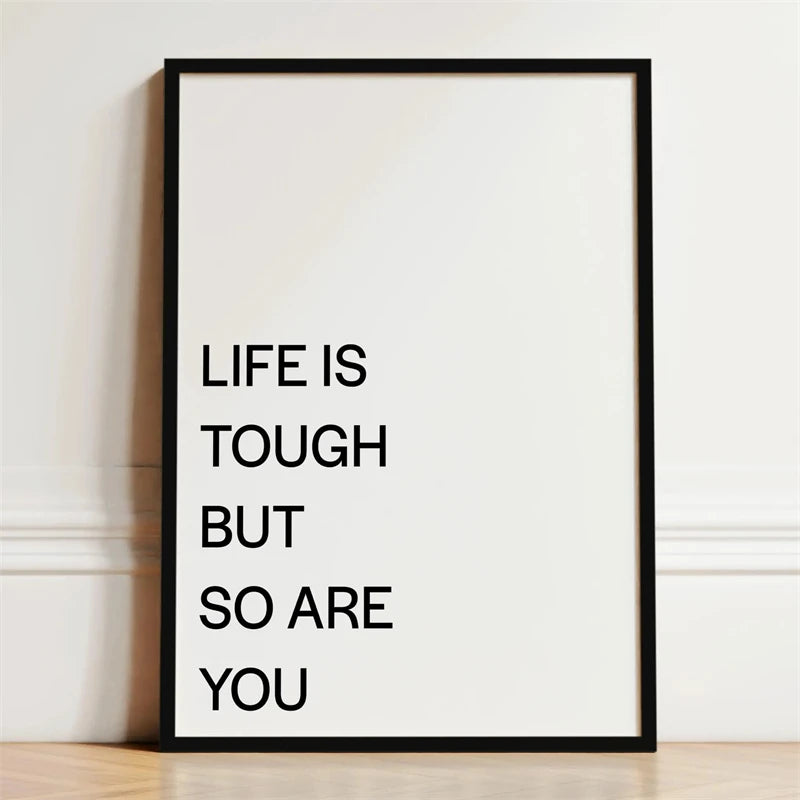 A framed canvas print with the text Life is tough but so are you written in black on a white background.