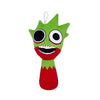 A bright green plush toy shaped like a strawberry with large black eyes and a wide smile.