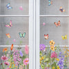 Window decals featuring colorful butterflies and wildflowers on a glass pane