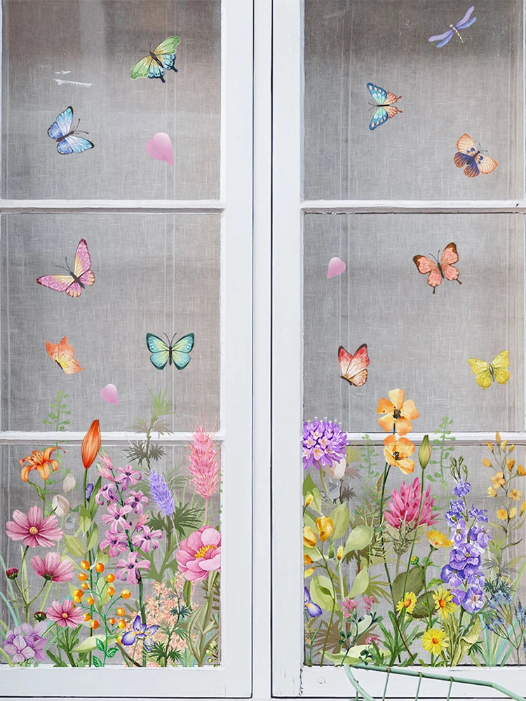 Window decals featuring colorful butterflies and wildflowers on a glass pane