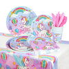 A set of unicorn themed birthday party supplies including plates, napkins, and pink feathers.
