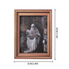 A framed print featuring a ghostly figure in white draped fabric against a dark background.