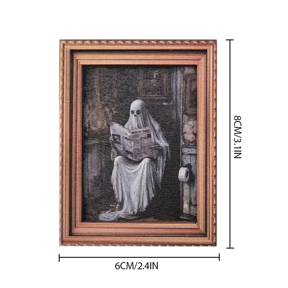 A framed print featuring a ghostly figure in white draped fabric against a dark background.