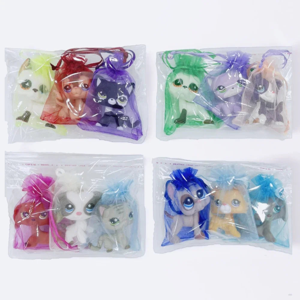 A set of three mini figures featuring dogs and cats in various colors and styles packaged in clear plastic bags.