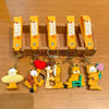 A set of orange keychains featuring Garfield cartoon characters and yellow hanging cords.