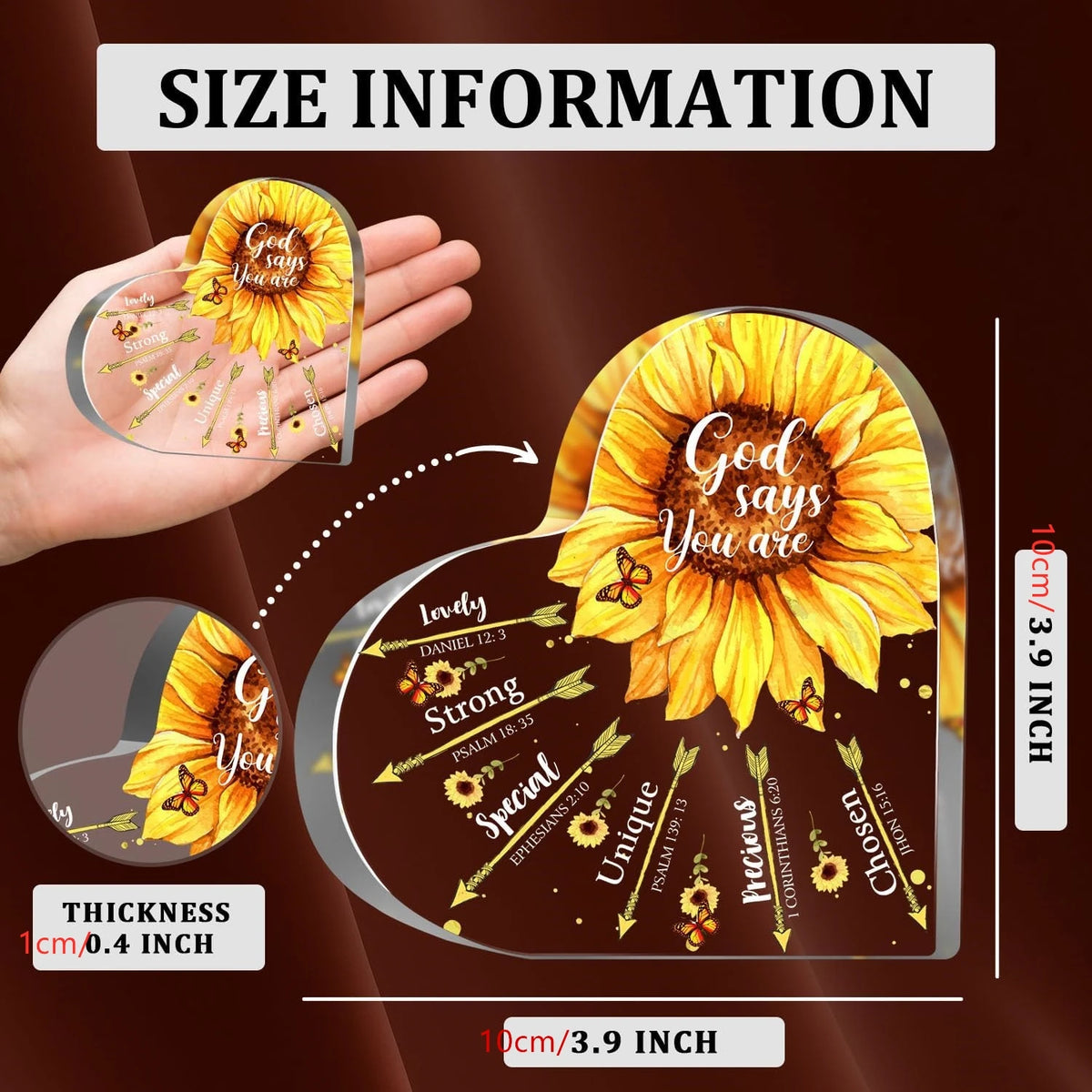 A hand holds a round, clear sunflower-shaped plaque with inspirational Bible verses engraved on it.