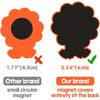 Comparison of a small orange flower magnet and a large black cloud magnet.
