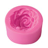 A pink silicone mold shaped like a rose flower for cake decorating.