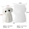 White silicone mold of a cute ghost figure used for crafting candles, soap, and resin
