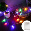String lights with star-shaped LED fairy lights illuminating a woven basket and a white mug