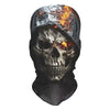 A dark, weathered skull face mask with glowing orange and yellow flames visible through the eye sockets.