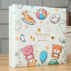 A white photo album titled My Baby Grow Up Memories featuring illustrations of baby items like a rocking horse, pacifier, and