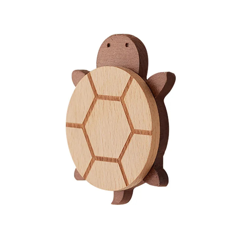 A wooden decorative animal hook shaped like a turtle, used for hanging items.