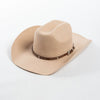 A beige wool cowboy hat with a brown studded leather band.
