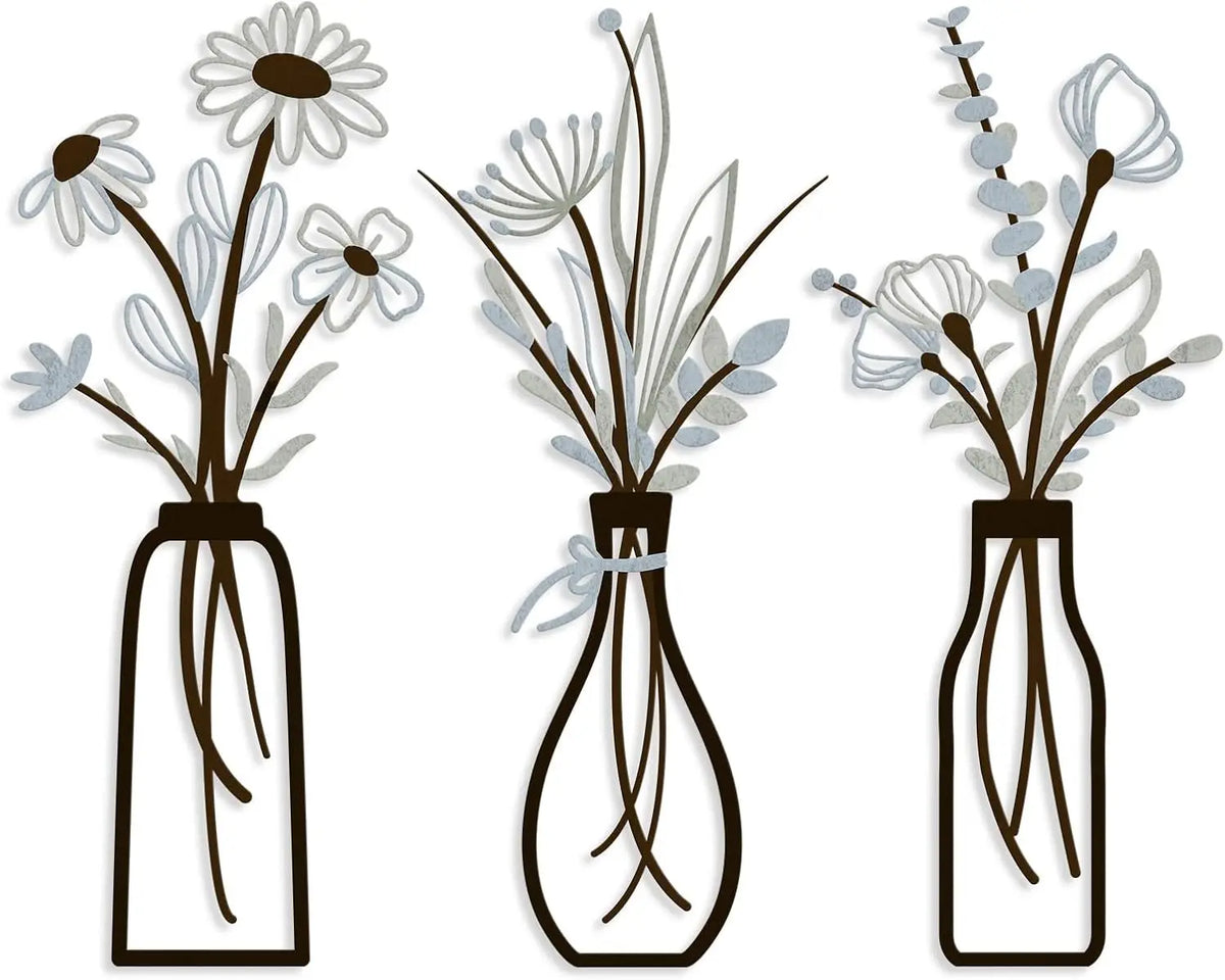 Set of three rustic metal vases with delicate white and gray flowers