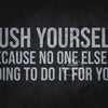 A motivational quote print on a dark background that reads Push Yourself because no one else is going to do it for you.
