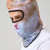A person wearing an orange and white cat face balaclava with ears.