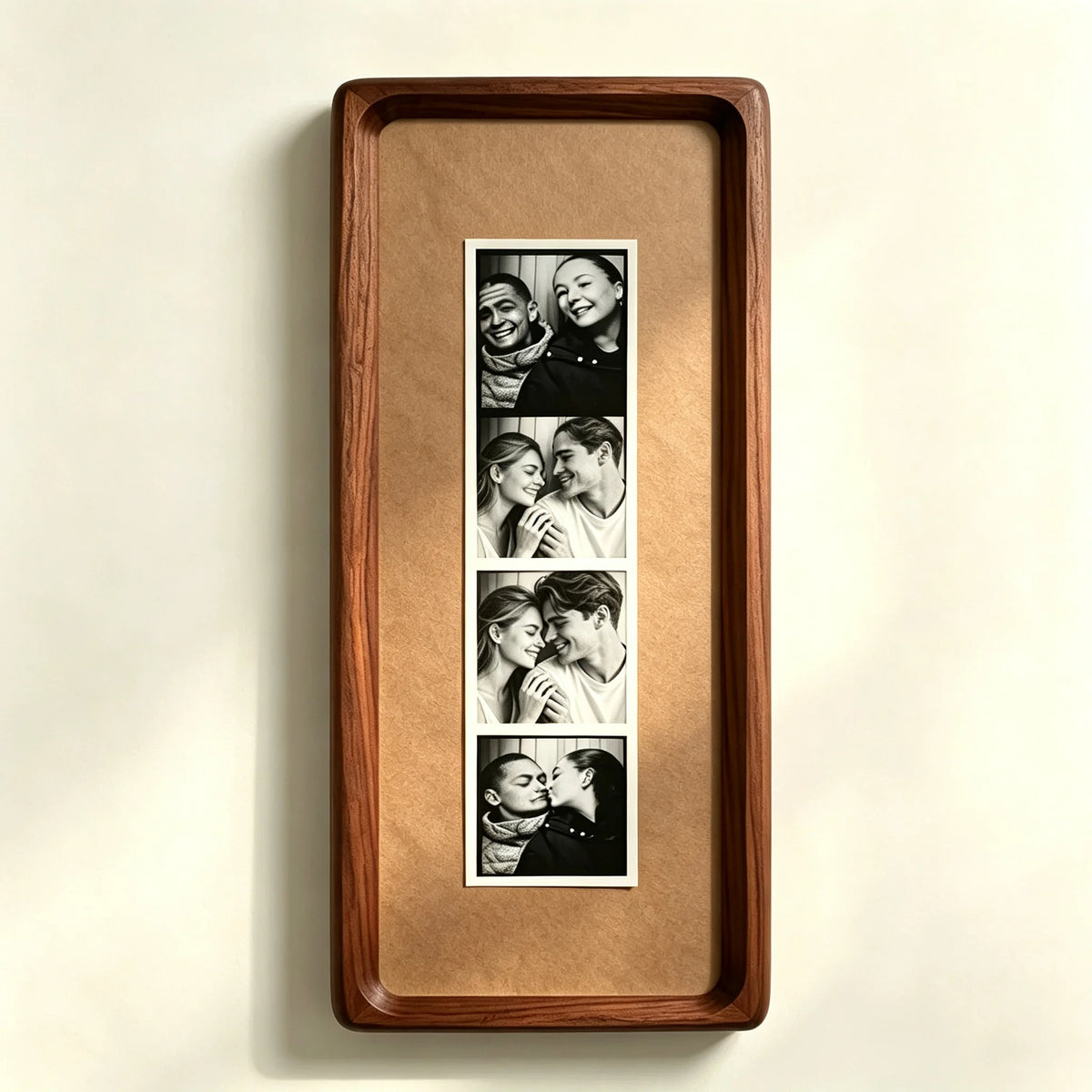 A wooden frame holds a vertical photo strip featuring several close-up portraits of couples.