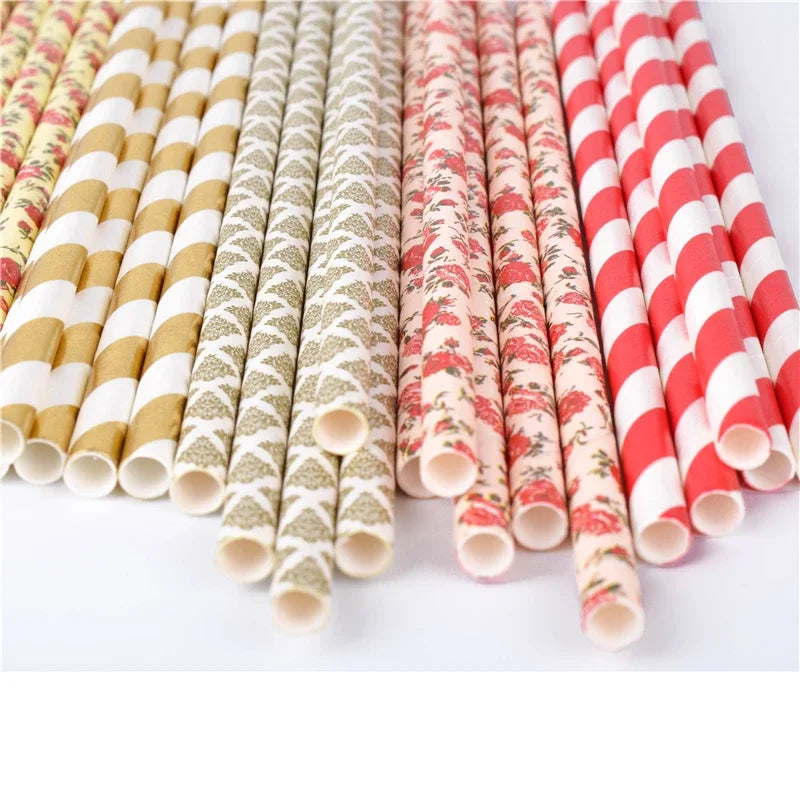 A collection of colorful striped and polka dot paper drinking straws in various patterns.