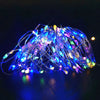 A bundle of blue and purple fairy string lights glowing brightly against a dark background.