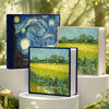 A set of three blue and green laminated photo albums featuring starry night skies and fields of yellow flowers.