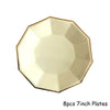 Eight 7-inch gold disposable plates arranged in a star pattern.