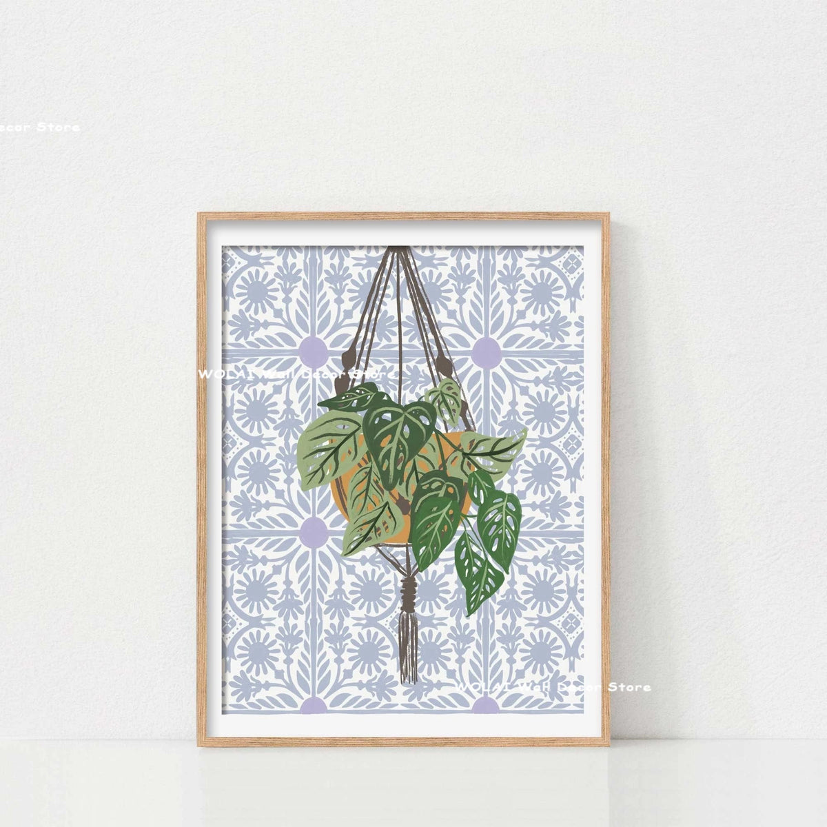 Botanical philodendron canvas wall art featuring a green plant in an orange pot on a patterned background