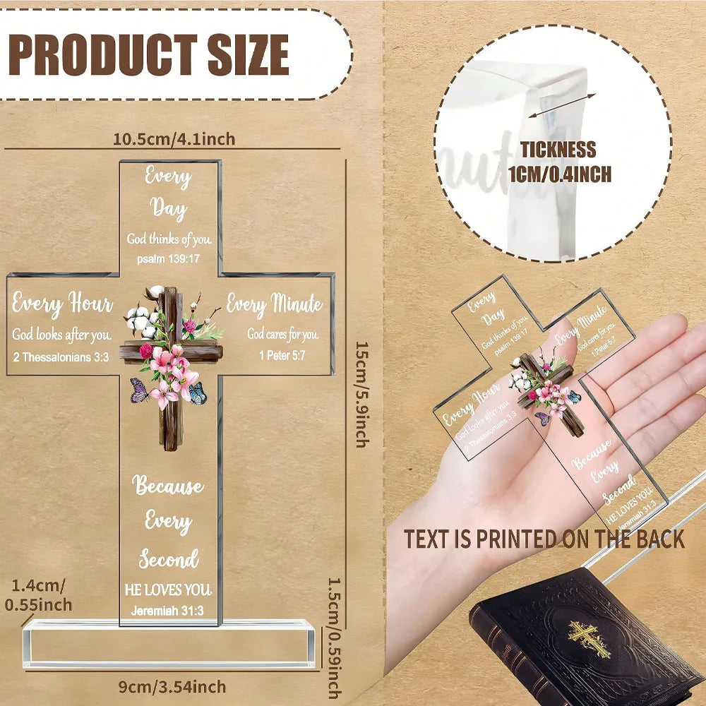 Acrylic cross with Bible verses printed on the back, displayed on a hand and a book.