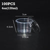 A set of 100 disposable clear plastic sauce cups with lids shown next to a measurement scale.