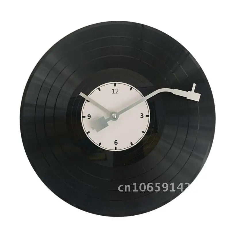 A black decorative vinyl record wall clock with a white face and hands.