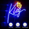 Neon sign spelling the word King in bright blue light on a dark background