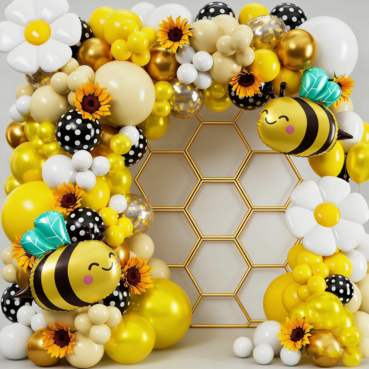 A vibrant balloon garland featuring yellow, gold, and white balloons with bee and flower accents.