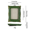 A vintage baroque resin picture frame in olive green with gold accents, shown with dimensions and weight.