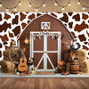 A rustic wooden barn door backdrop featuring a white door and decorative elements against a patterned wall.