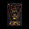 A tapestry featuring a stylized winged skull design in gold and red tones.
