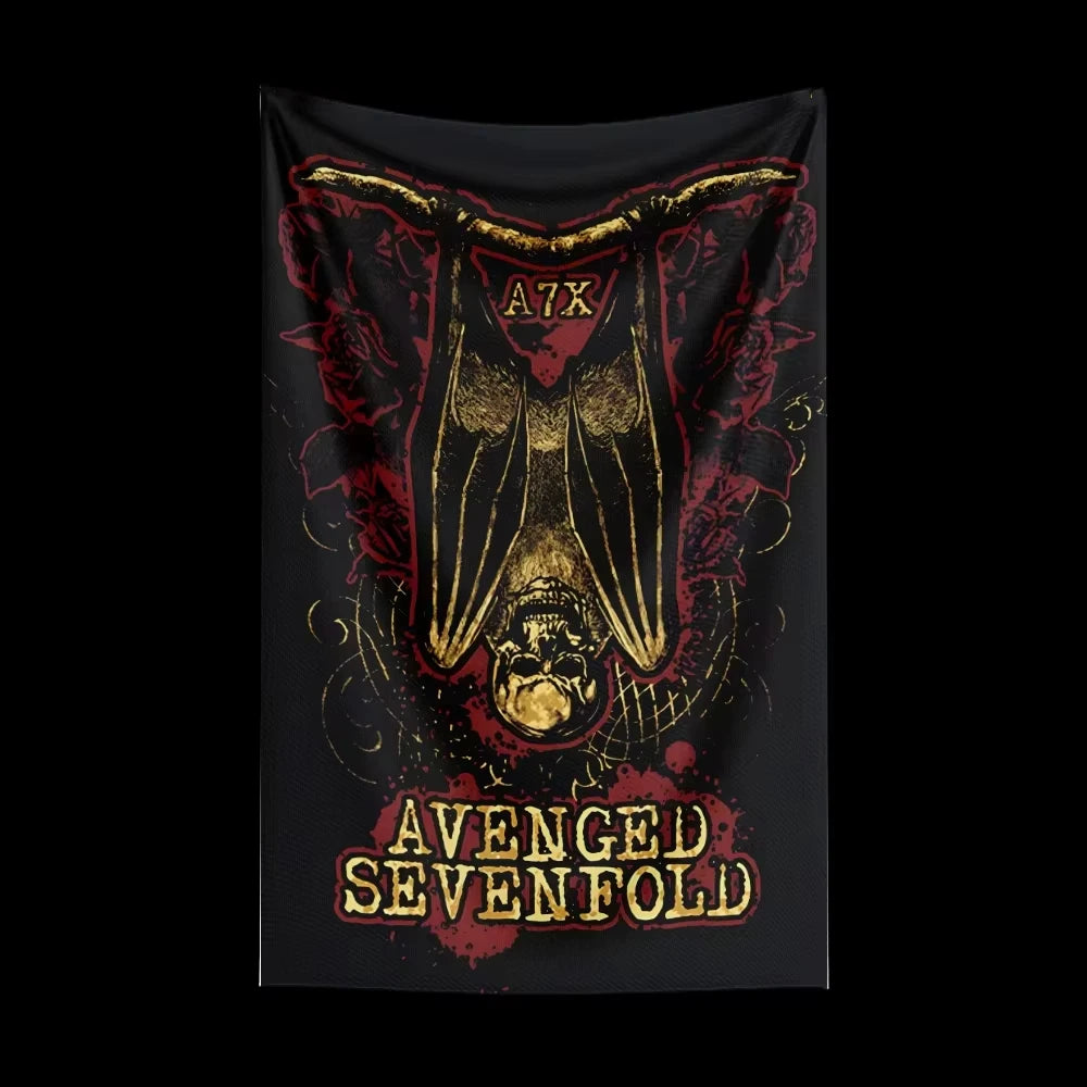 A tapestry featuring a stylized winged skull design in gold and red tones.