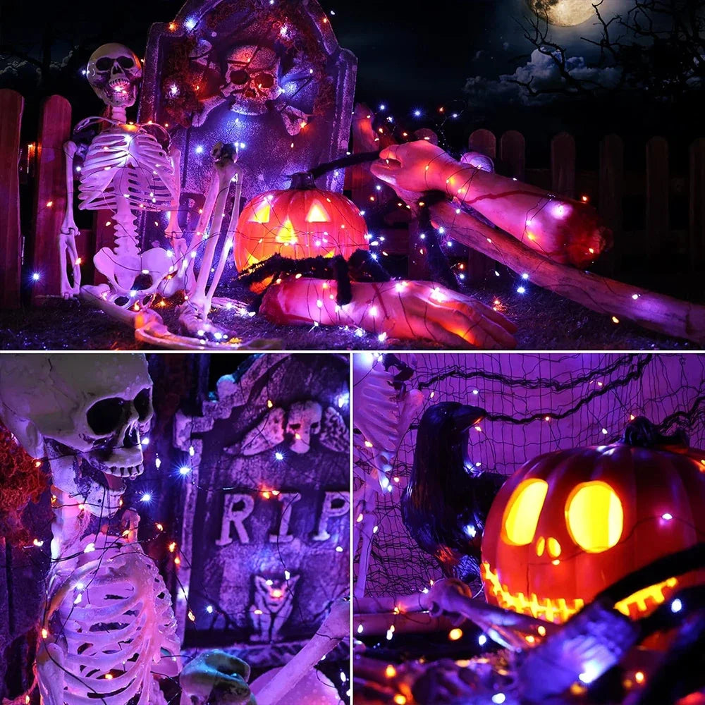 Purple and orange fairy string lights illuminating a Halloween scene with skulls and pumpkins.