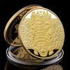 A gold-plated commemorative coin featuring the Maya prophecy calendar design.