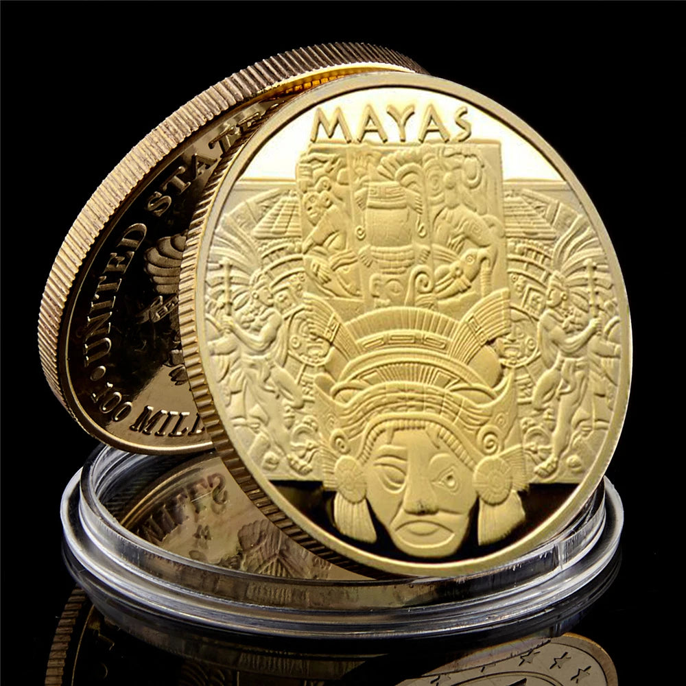 A gold-plated commemorative coin featuring the Maya prophecy calendar design.