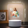 A 3D LED night light featuring a depiction of Jesus with a dove and flowers on a square panel.
