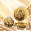 A clear jar of golden commemorative coins labeled Universal Wealth and Money Flows to Me resting on a gold surface.