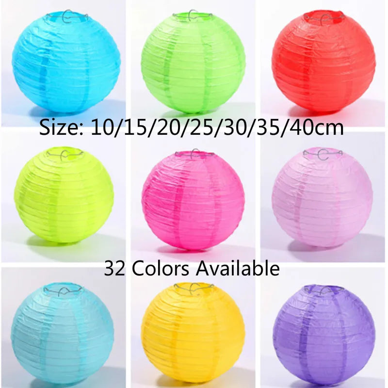A collection of round paper lanterns in various shades of blue, green, pink, and yellow, showing different sizes.