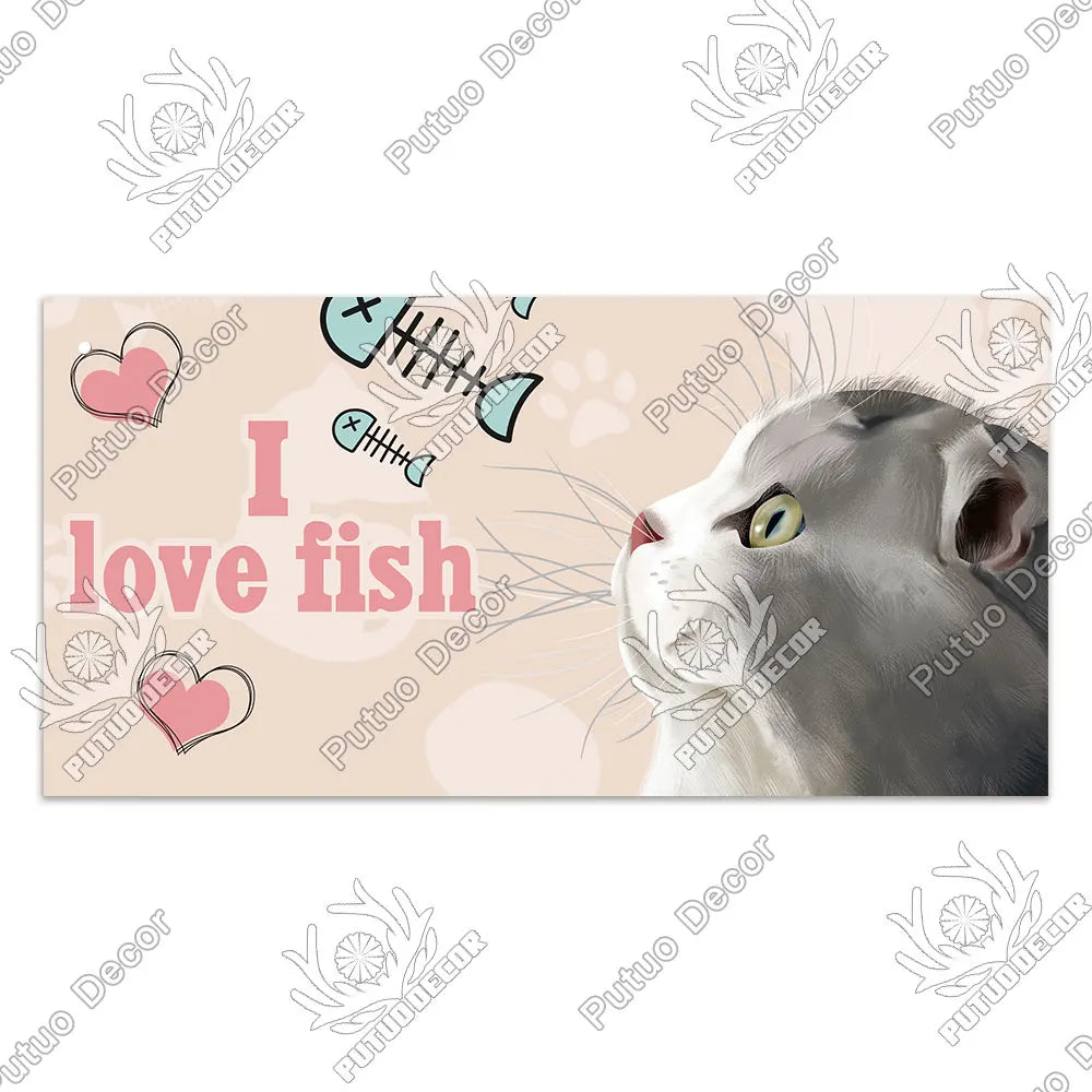 A light gray cat looks toward the viewer with a pink heart and fish icons surrounding the text I love fish