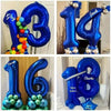 A collection of large blue foil number balloons spelling out 13, 14, and 16 for birthday party decor.