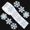 A roll of white sticker paper decorated with blue glitter snowflakes.