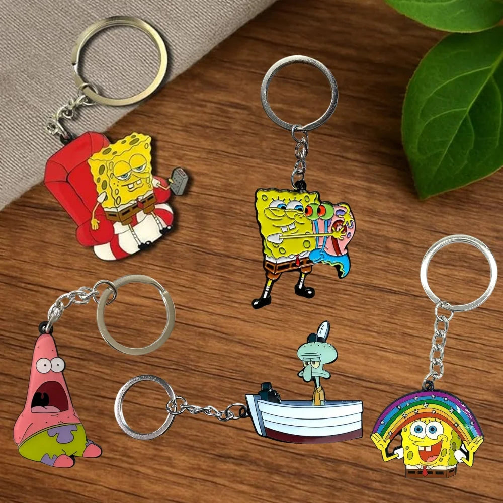A set of SpongeBob SquarePants cartoon keychains featuring characters like SpongeBob, Patrick, and Squidward on metal split r
