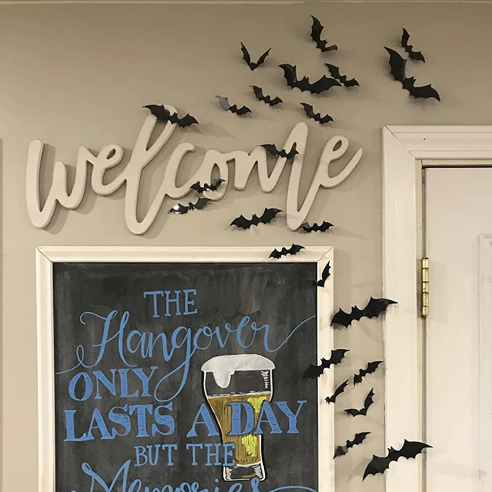 White script wall decor featuring bats and text about hangover recovery