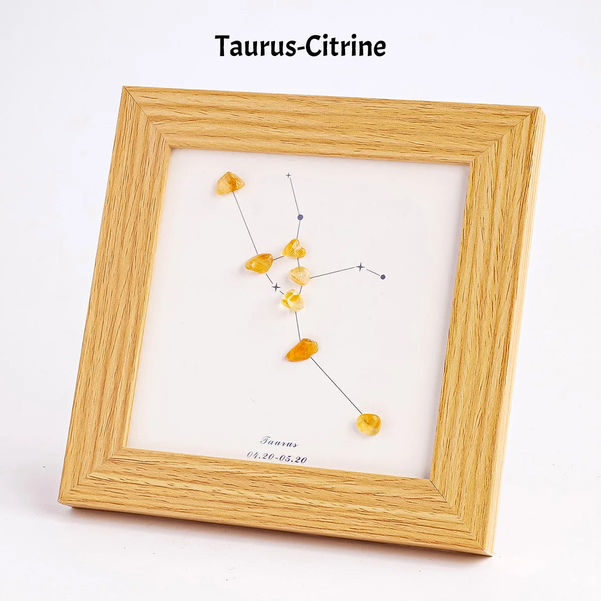 Holzrahmen mit dem Taurus-Citrin-Tierkreiszeichen und kleinen gelben Kristallen